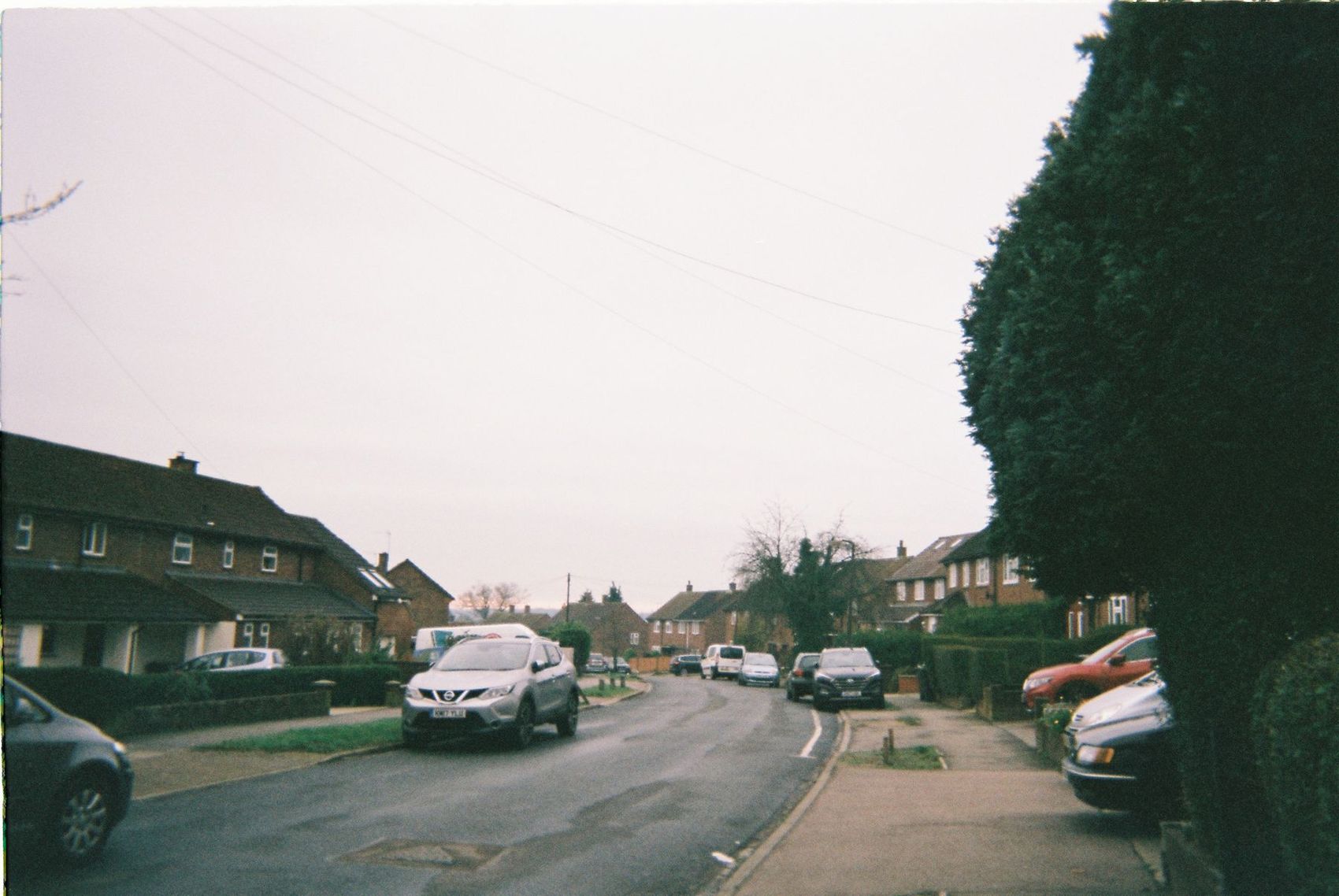 A quiet suburban street of semi-detached houses