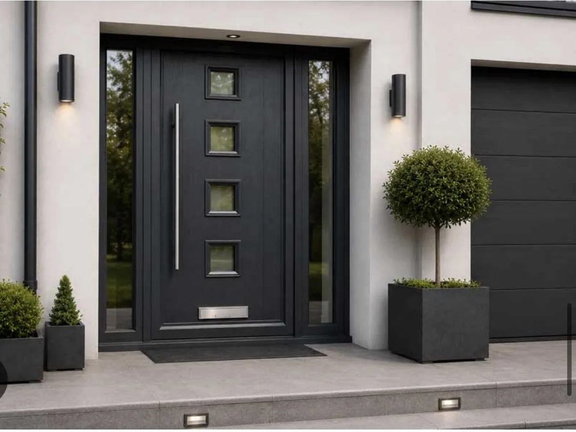 Anthracite front door with four square glazed panels, a long silver handle and glazed side panels